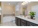 Well-appointed bathroom featuring a soaking tub, elegant vanity, and contemporary fixtures at 201 Finsbury St # 201, Durham, NC 27703