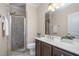 Bathroom featuring a walk-in shower with glass enclosure, vanity with plenty of storage space at 201 Finsbury St # 201, Durham, NC 27703