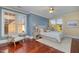 Cozy bedroom with natural light, ceiling fan, and soothing color palette for a relaxing retreat at 201 Finsbury St # 201, Durham, NC 27703