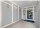 Well-lit entrance featuring a glass door with secure access and neutral color paneling at 201 Finsbury St # 201, Durham, NC 27703
