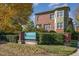 Exterior view of Davis Park showcasing brick architecture and lush landscaping at 201 Finsbury St # 201, Durham, NC 27703