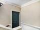 Hallway featuring a unit entrance with neutral walls, bright trim, and well-lit space at 201 Finsbury St # 201, Durham, NC 27703
