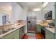 Updated kitchen features granite countertops, stainless steel appliances, and ample cabinet space at 201 Finsbury St # 201, Durham, NC 27703