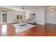 Bright living room featuring hardwood floors, large windows, and modern neutral furnishings at 201 Finsbury St # 201, Durham, NC 27703