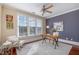 Bright office space with large windows, hardwood floors, and a ceiling fan, great for work or study at 201 Finsbury St # 201, Durham, NC 27703