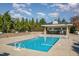Relaxing pool area with clear water and a covered lounging area, perfect for summer days at 201 Finsbury St # 201, Durham, NC 27703