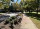 Neighborhood street view featuring a tree-lined sidewalk and inviting benches at 201 Finsbury St # 201, Durham, NC 27703