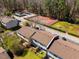 Aerial view of townhomes, tennis court, and a pool, showcasing community amenities and residential buildings at 220 Elizabeth St # F-2, Chapel Hill, NC 27514