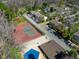 Aerial view showing community amenities including a tennis court, pool, and parking at 220 Elizabeth St # F-2, Chapel Hill, NC 27514