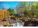 Patio with outdoor seating and fire pit, surrounded by mature trees and landscaping at 220 Elizabeth St # F-2, Chapel Hill, NC 27514