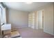 Bright bedroom featuring neutral walls and carpet, window with natural light, and ample storage at 220 Elizabeth St # F-2, Chapel Hill, NC 27514
