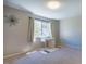Bedroom with neutral walls, natural light from the window, and space for a desk and decor at 220 Elizabeth St # F-2, Chapel Hill, NC 27514