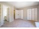 Spacious bedroom with multiple closets, neutral carpet, and an ensuite bathroom for convenience at 220 Elizabeth St # F-2, Chapel Hill, NC 27514