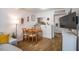 Cozy dining room area adjacent to the kitchen and a comfortable sofa at 220 Elizabeth St # F-2, Chapel Hill, NC 27514