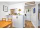 Cozy dining area next to the kitchen with white cabinets, a table and chairs at 220 Elizabeth St # F-2, Chapel Hill, NC 27514