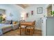 Inviting dining area next to the living room with a sofa and decor at 220 Elizabeth St # F-2, Chapel Hill, NC 27514
