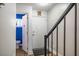 Entryway features the front door, staircase, and a half bathroom with a blue accent wall at 220 Elizabeth St # F-2, Chapel Hill, NC 27514