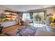 Cozy living room with a sliding door, a colorful rug, and built-in bookshelves at 220 Elizabeth St # F-2, Chapel Hill, NC 27514