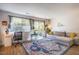 Bright living room featuring a large window, a sofa, and a colorful rug at 220 Elizabeth St # F-2, Chapel Hill, NC 27514