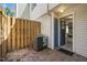 Enclosed patio space with brick pavers and access to the interior, featuring an AC unit at 220 Elizabeth St # F-2, Chapel Hill, NC 27514