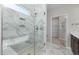 Bathroom featuring glass shower and marble tile at 2340 Beeblossom Pl, Fuquay Varina, NC 27526