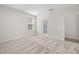 Carpeted bedroom featuring neutral tones with attached bathroom and ample natural light at 2340 Beeblossom Pl, Fuquay Varina, NC 27526