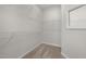 Walk-in closet with carpeted floors, wire shelving and a mirror at 2340 Beeblossom Pl, Fuquay Varina, NC 27526
