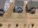 Aerial shot of the backyard, highlighting the concrete patio, neighboring homes, and overall landscape at 25 Carlton Ln, Franklinton, NC 27525