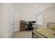 Functional bedroom designed as an office with desk setup, neutral walls, carpet, and ample lighting at 25 Carlton Ln, Franklinton, NC 27525