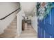 Inviting entryway with wood-look flooring, staircase, and a view into the bright and open living space at 25 Carlton Ln, Franklinton, NC 27525