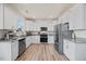 Modern kitchen with white cabinets, stainless steel appliances, and beautiful countertops at 25 Carlton Ln, Franklinton, NC 27525