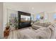 Bright living room featuring modern floors, large windows, stylish decor and comfortable seating at 25 Carlton Ln, Franklinton, NC 27525
