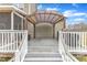 Outdoor deck featuring a covered seating area and stairs down to the yard at 250 Spring View Ln, Pittsboro, NC 27312
