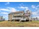 Expansive backyard featuring a large deck, screened-in porch, and mature trees, perfect for outdoor living at 250 Spring View Ln, Pittsboro, NC 27312