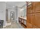 This spacious bathroom features a double vanity, walk-in shower, and wood-look floors at 250 Spring View Ln, Pittsboro, NC 27312
