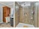 A tiled shower, linen storage, and window feature in this bright, neutral bathroom at 250 Spring View Ln, Pittsboro, NC 27312