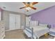 Cozy bedroom with plush carpet, ceiling fan and a view of the backyard at 250 Spring View Ln, Pittsboro, NC 27312