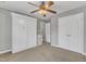 Neutral bedroom featuring a fold away bed, storage and a ceiling fan at 250 Spring View Ln, Pittsboro, NC 27312