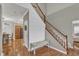 Open foyer featuring a staircase, shiplap accent wall and view to the dining room at 250 Spring View Ln, Pittsboro, NC 27312