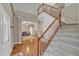 Expansive foyer featuring a staircase, view to the living room and beautiful hardwood floors at 250 Spring View Ln, Pittsboro, NC 27312
