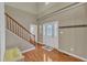 Bright foyer showcasing hardwood floors, staircase, high ceilings, and elegant decor at 250 Spring View Ln, Pittsboro, NC 27312