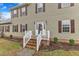 Inviting front entrance with decorative glass door, brick steps, and well-maintained landscaping at 250 Spring View Ln, Pittsboro, NC 27312