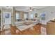 Bright living room with wood floors, large sectional couch, and lots of natural light at 250 Spring View Ln, Pittsboro, NC 27312