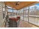 Relaxing screened porch with seating and a view of the backyard at 250 Spring View Ln, Pittsboro, NC 27312