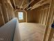 Bedroom in progress features new framing, a window view, and electrical wiring at 3015 Dog Rose Drive Lot 170 Dr, Durham, NC 27703