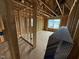 Bedroom in progress showcases natural light through a window and new electrical wiring at 3015 Dog Rose Drive Lot 170 Dr, Durham, NC 27703