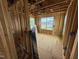 Bedroom in progress boasts natural light through a window and new electrical wiring at 3015 Dog Rose Drive Lot 170 Dr, Durham, NC 27703