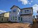 The exterior of a two-story house is under construction with windows and siding yet to be completed at 3015 Dog Rose Drive Lot 170 Dr, Durham, NC 27703