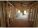Hallway featuring unfinished wood framing, electrical, and a view from the window at 3015 Dog Rose Drive Lot 170 Dr, Durham, NC 27703