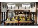 Stylish interior with modern lighting fixtures, bar seating, and tables for social gatherings at 3015 Dog Rose Drive Lot 170 Dr, Durham, NC 27703